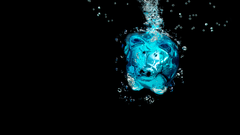 Image by Getty Signature from Canva pro of blue piggy bank in dark water with bubbles